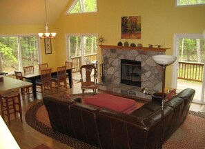 living room, dining room, deck overlooking nature preserve