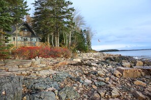 Ledgerock and boulder shore at low tide