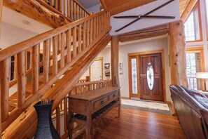 Front entrance and stairs to 3-bedrooms + 1 full bathroom upper level. 