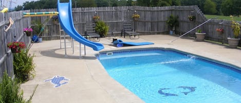 pool with slide and waterfall,tropical plants,, taken 8 7 2014