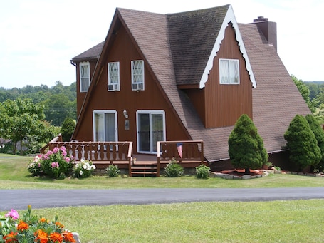 front/view from driveway /road/ flowers in bloom..... taken 9/2.