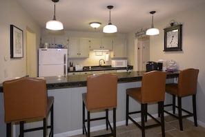 counter with 4 barstools