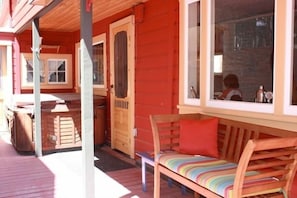 Side Porch, with hot tub, bench and low fence