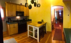 Kitchen with bar stools and island