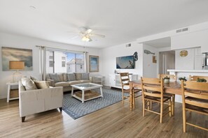 View of living, dining and kitchen areas from the main entry door.
                