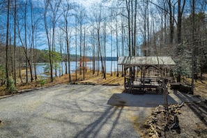 View of pavilion and beyond to firepit and lake access. Lots of paths to explore