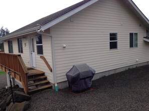 Rear View of Upstairs Apartment, Parking by Barbecue
