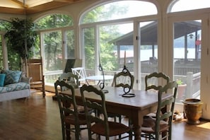 Sunporch additional dining with view of boat house and lake