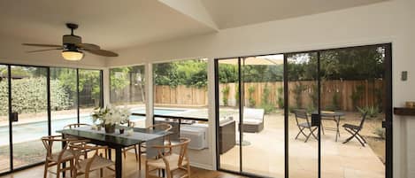 Newly renovated dining room opening up to garden.