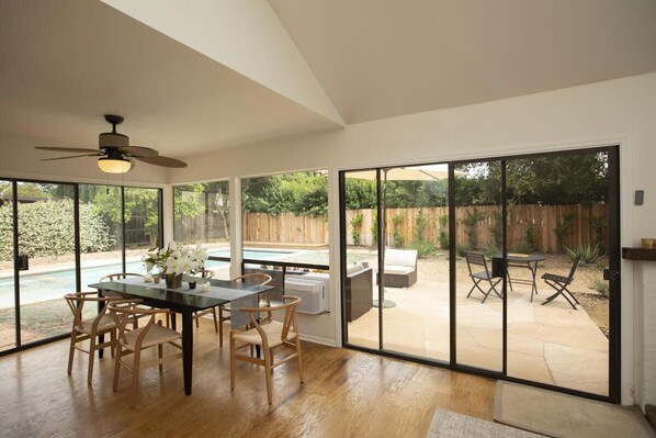 Newly renovated dining room opening up to garden.