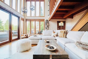 Main floor living room with down stuffed sectional and lake view