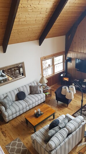 Looking down from the loft to living room area