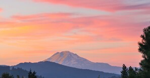 A typical sunset lights up glaciers on Mt. Adams. View from most of the house