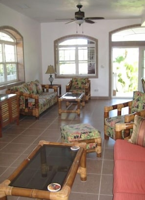 Well furnished family room and beautiful view of the Caribbean Ocean.