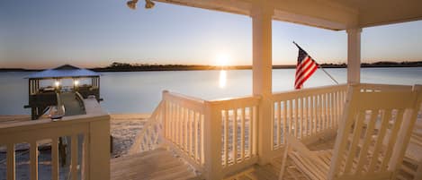 Enjoying another sunset on our porch with a glass of wine in hand :)