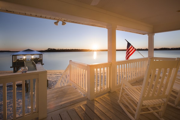 Enjoying another sunset on our porch with a glass of wine in hand :)