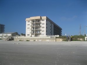  50 unit complex, family oriented, gated entry on no drive beach. Mansard blue.