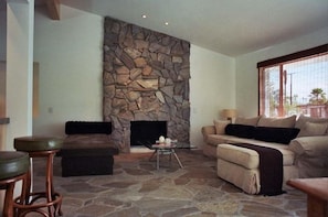 Spacious living room with gorgeous slate floors and gas fireplace