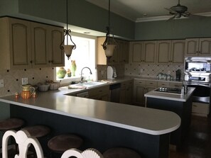 Large kitchen with bar area that seats 4. 