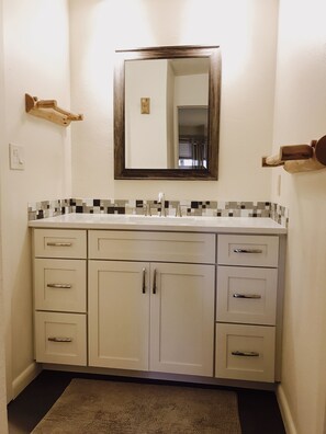 All three bathrooms have been remodeled, similar to this one shown here.