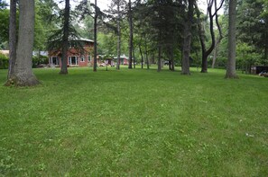 View of the 2 acre fenced in yard (Lake house on the left)
