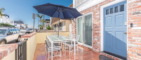 The front patio is the perfect spot to catch morning and afternoon sunshine. It includes a dining table for 6 and a built-in gas BBQ grill.