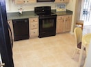 Eat In Kitchen with NEW 17" tile flooring & conveniences of home.