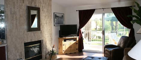 Living room with view of pool and grounds