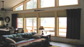 Open living area with view of river during dining or relaxing