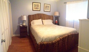 wide view of main bedroom with queen bed