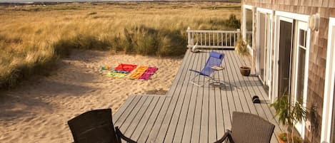 Our large beachside deck, with great sand play area for the kids & Patio Set