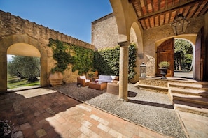 Courtyard (entrance side), with direct access to the villa, garden & swimming pool