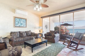 The large living room is set facing the ocean