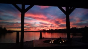 Lake view from the dock at sunset with fire in the fireplace.  Breathtaking!!