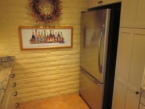 Huge stainless steel refrigerator and large pantry 