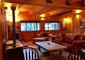 Living room with views of private lake, wood stove,  54" LCD, card table 