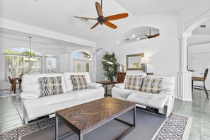 Living room with two leather power reclining sofas