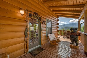 Detailed bear trim around doors and windows. Wrap around deck!