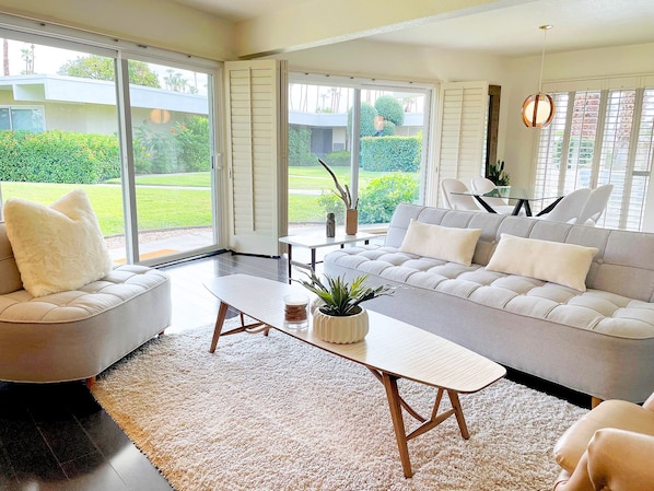 Living room space with a sweeping view of the outdoor landscape.