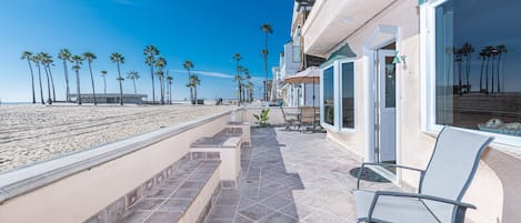 The best seat in the house is on the expansive front patio, which looks out onto the pedestrian boardwalk and beach. Keep your eyes peeled for dolphins!