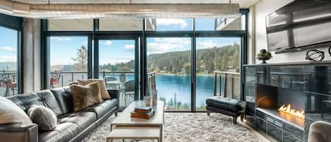 Living room with water view and gas fireplace