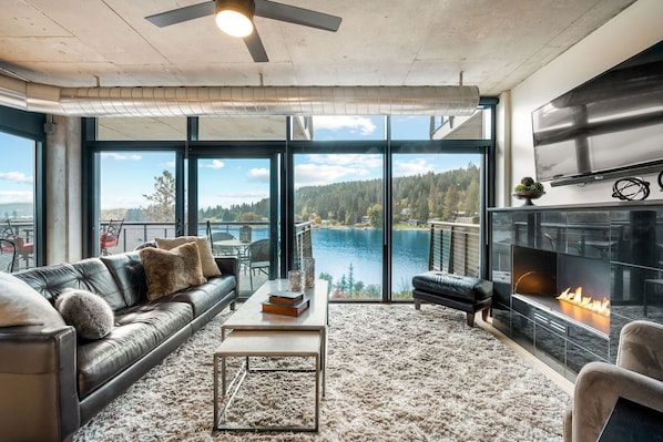 Living room with water view and gas fireplace