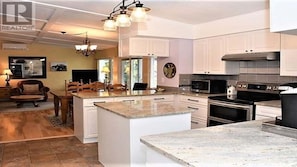 Kitchen, fully stocked, includes Keurig, stainless steel and granite