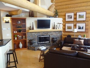 Great room fireplace and 40' TV. Satellite TV with hundreds of channels.