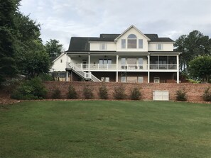 The rear of the home has three levels, and a large play area out back.