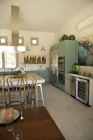 Ready to cook, and enjoy: two convection ovens, ice machine, & wine cooler