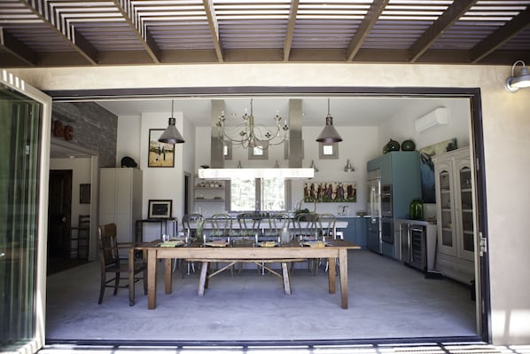 The expansive kitchen, looking through the huge fold-away door from the patio