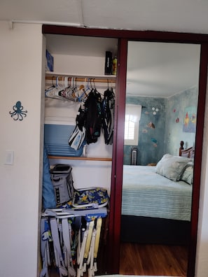 2nd Bedroom closet is full of beach toys, beach chairs coolers etc