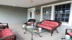 Enjoy your morning coffee with a good book on our covered front porch.