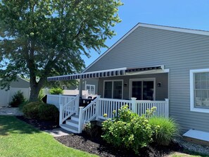 Wrap around deck with awning to provide lots of shade for your dining pleasure